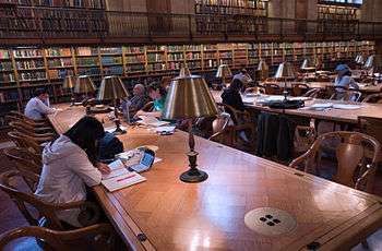 patrons studying and reading at the new york city public library